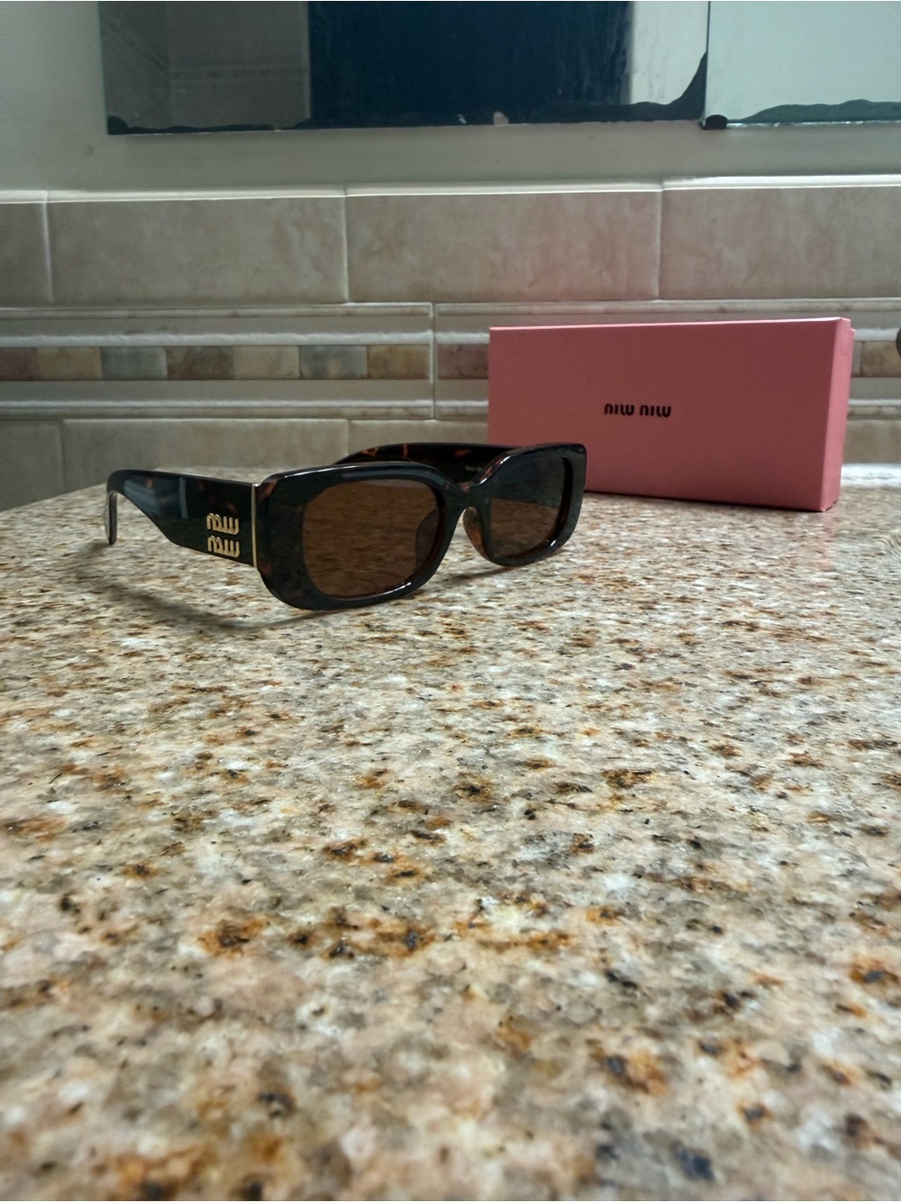 Miu Miu Tortoiseshell Sunglasses with Gold Temple Logo and Brown Lenses